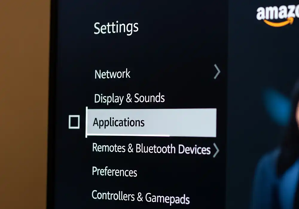 The Firestick Settings menu with "Applications" selected